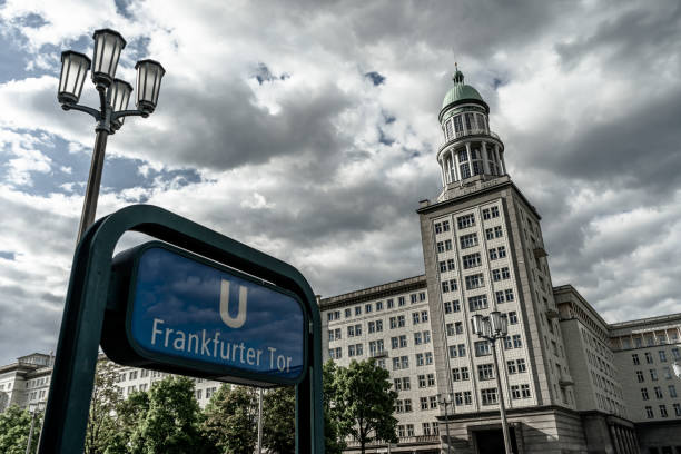 Berlin, Germany – May 14, 2020: BERLIN, GERMANY May 14, 2020. The Frankfurter Tor Gate Tower and U Bahn station sign in Friedrichshain Eastberlin.