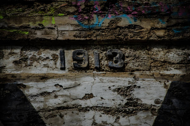 istock Closeup shot 1913 curved on an old weathered wall 1437201520