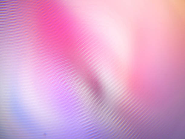 istock Abstract background with staggered, refracted, mottled pink light layers and vortex lighting effects 1437202825