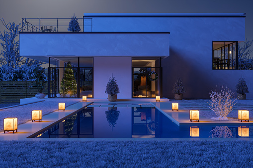 3D rendering of an impressive contemporary villa with garden and pool at dusk