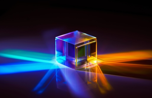 A closeup shot of the light spectrum reflected from a crystal cube