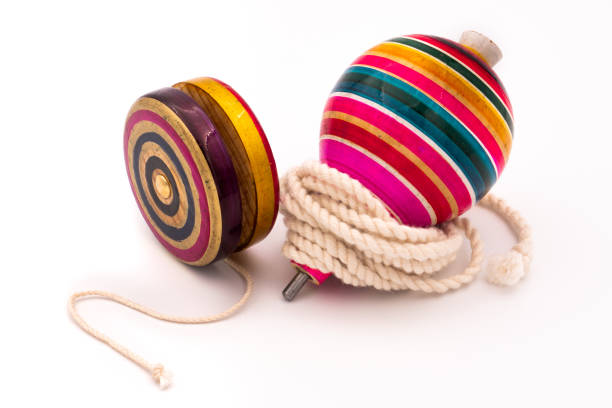istock Colorful yo-yo and trompo on a white background 1437204088