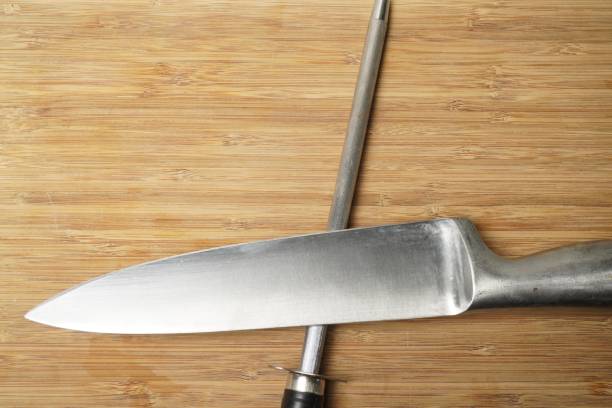istock Closeup shot of a knife over the sharpener 1437204837