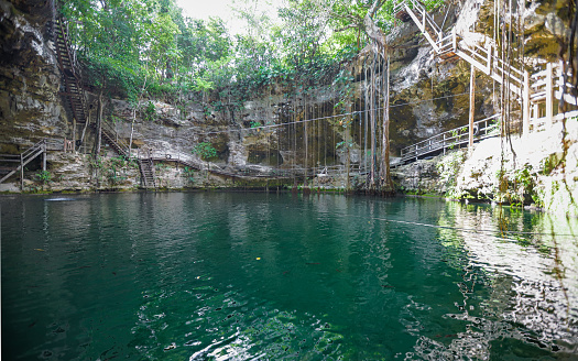 Vallado, Mexico – May 31, 2019: Cenote X'Canche is a natural limestone sinkhole popular for swimming in Mexico's Yucatan region.