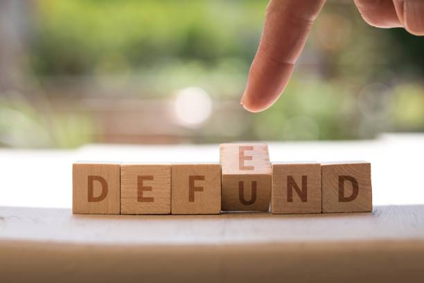istock DEFEND DEFUND Police concept on wood blocks 1437205629