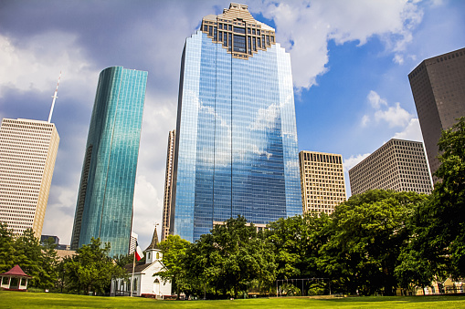 A beautiful view of modern skyscrapers from Sam Houston Park in Houston, Texas
