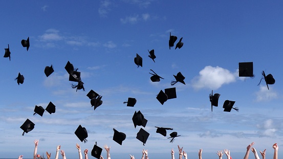 The background of the graduation cap flying against the sky at the graduation ceremony, 3d rendering