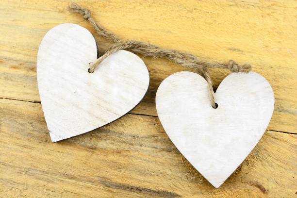 istock Wooden white hearts on a wooden surface 1437208329
