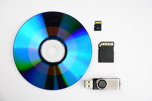 An SD disk, a flash and a two chips  isolated on a white background