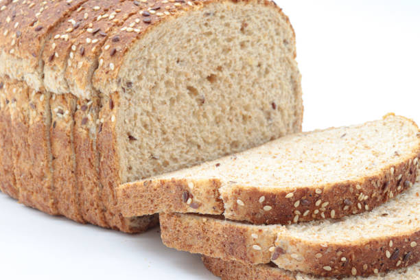 istock Close-up sliced ​​wholemeal bread, on white background 1437210055