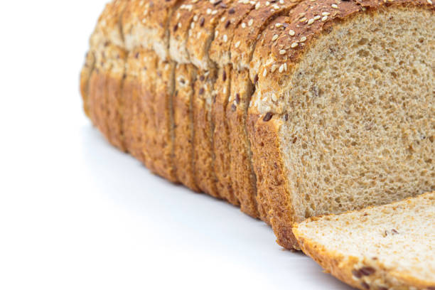 istock Close-up sliced ​​wholemeal bread, on white background 1437210122