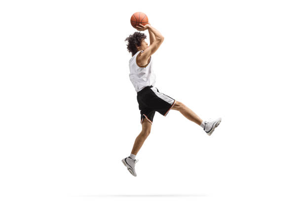 istock Athlete jumping and shooting a basketball 1437210664