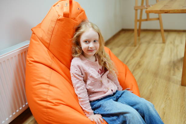 istock Girl in chair. 1437212546