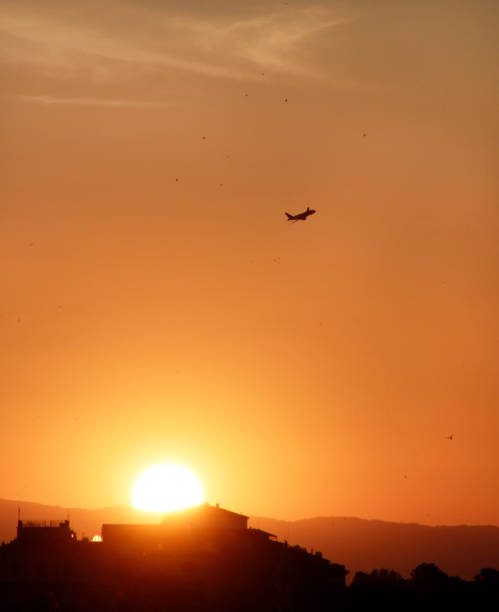 Airplane rising into the sky during sunset in Florence, Italy Airplane rising into the sky during sunset in Florence, Italy florence italy airport stock pictures, royalty-free photos & images