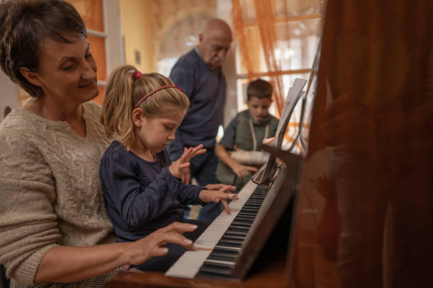 istock Girl learning to play the piano 1437219452