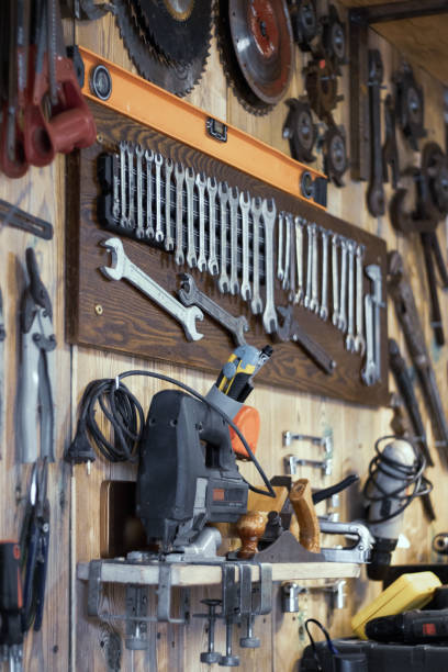 istock Various tools hang on a wooden wall in a workshop 1437219805
