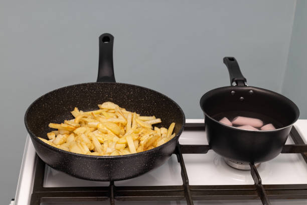 istock frying pan with fried potatoes in the kitchen 1437224970
