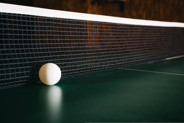 Ping pong ball are on the green game table