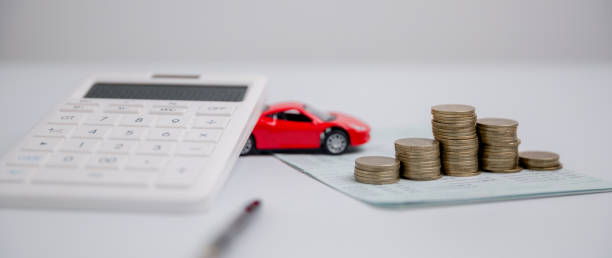 Concept of car insurance business, saving buy - sale with tax and loan for new car. Car toy vehicle with stack coin money on background. Planning to manage transportation finance costs. loan for car stock photo