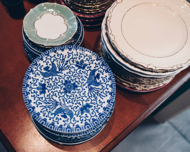 istock Elevated view of ornate plates on wooden table 1437226489
