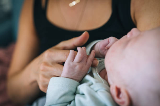 istock Mother cradles infant girl 1437226746