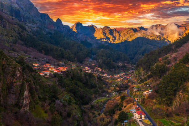 Colorful sunset above Curral Das Freiras village on Madeira Island, Portugal stock photo