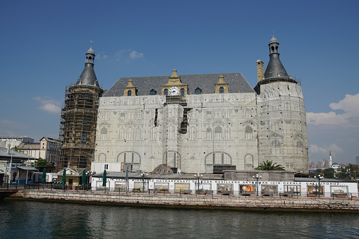 Istanbul, Turkiye - August 27, 2022: Haydarpasa railway station is being restored after roof fire. Station was built in 1909.