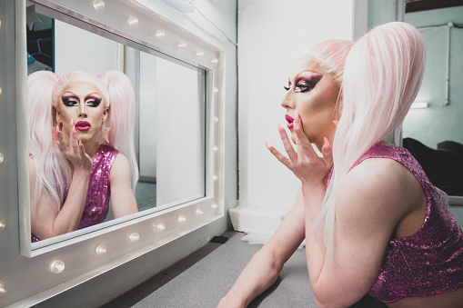 Drag Queen Getting Dressed Backstage before Performance in Dressing room