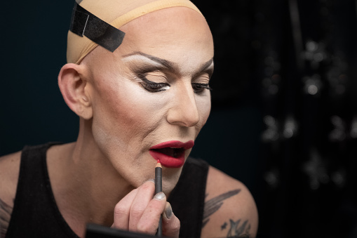 Drag Queen Getting Dressed Backstage before Performance in Dressing room