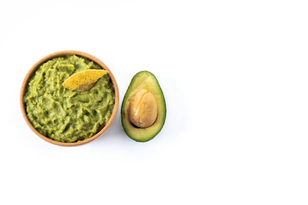 istock Mexican guacamole with nacho chip isolated on white background 1437230696