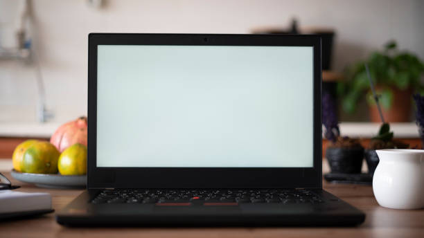 istock Laptop stands on the table in the kitchen 1437232013