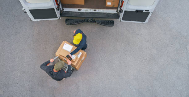 istock Delivery person taking signature from customer 1437232309