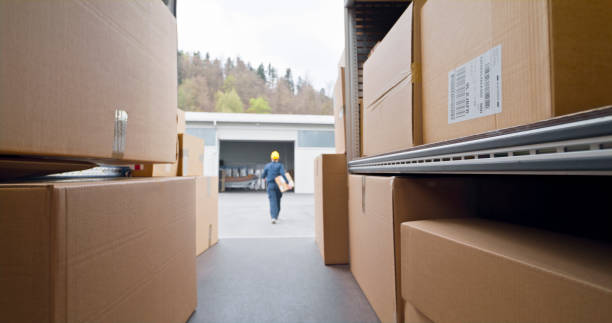 istock Deliver woman carrying box 1437232315