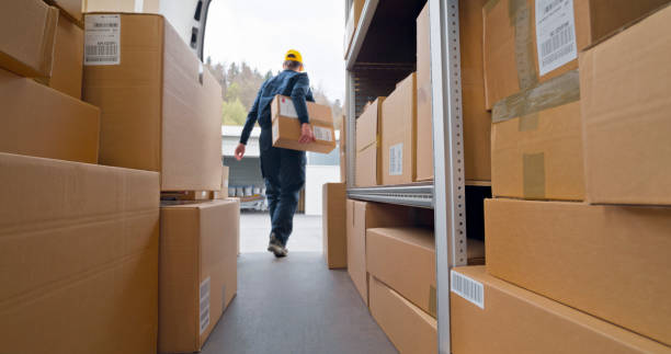 istock Deliver woman carrying box 1437232316