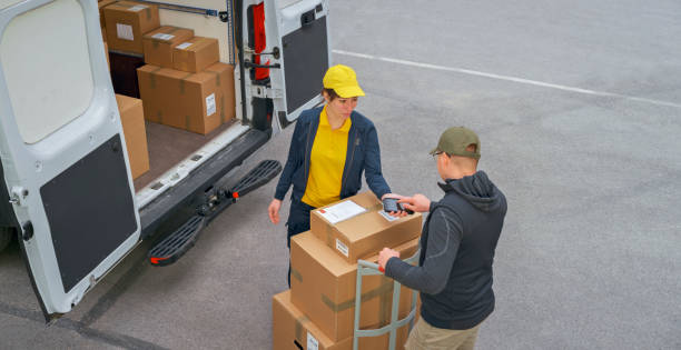 istock Delivery person taking signature from customer 1437232331