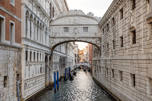 Venice, Italy - October 6th 2022: The Bridge of Sighs or Ponte de i Sospiri made from limestone in year 1600 is one of the most famous landmarks in Venice