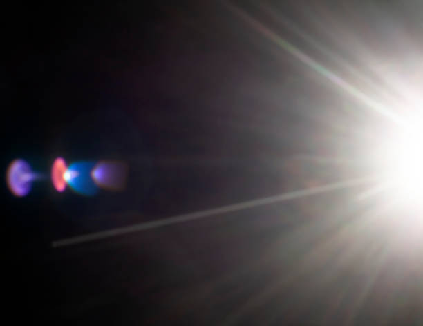 istock refracted rays of the sun on a black background 1437232704