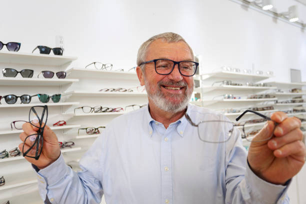 istock Senior trying new eyeglasses 1437235263