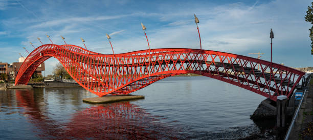 istock Red Python Bridge in Amsterdam, connecting Sporenburg and Borneo Island in Eastern Docklands 1437236253