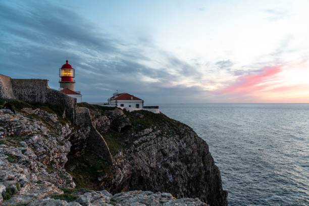 istock Lighthouse on cliff at cap Sao Vicente during Sunset 1437236795