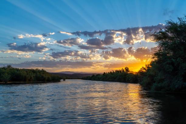 istock Scenic view of the lake and forest on a sunset 1437238049