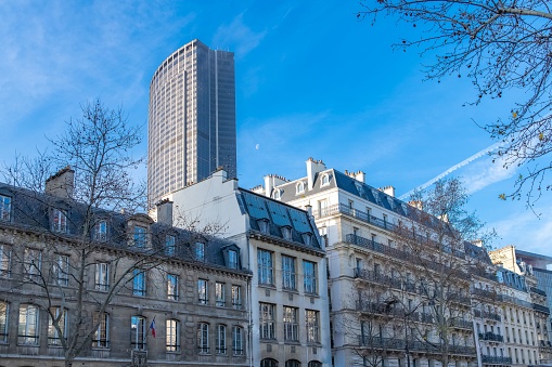 Paris, typical buildings, beautiful facades with the Montparnasse tower in background