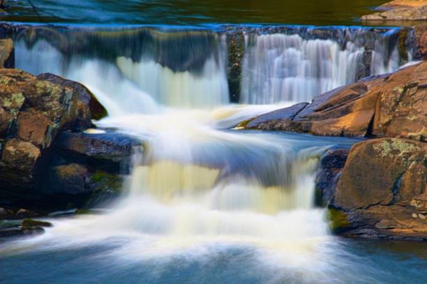 istock Long exposure of a small cascade on the rocks 1437238367