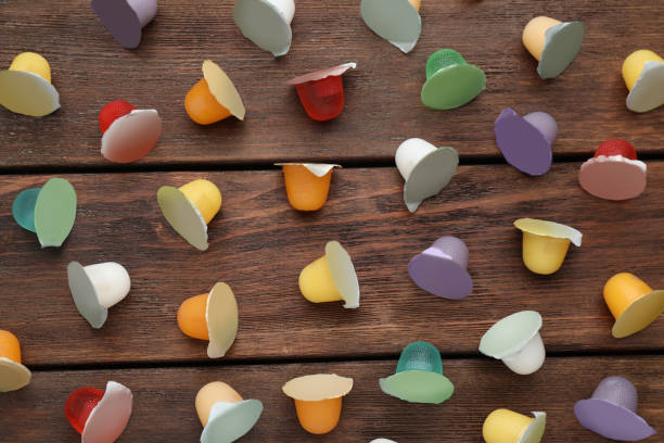 istock Tasty bright jelly cups on wooden table, flat lay 1437240414