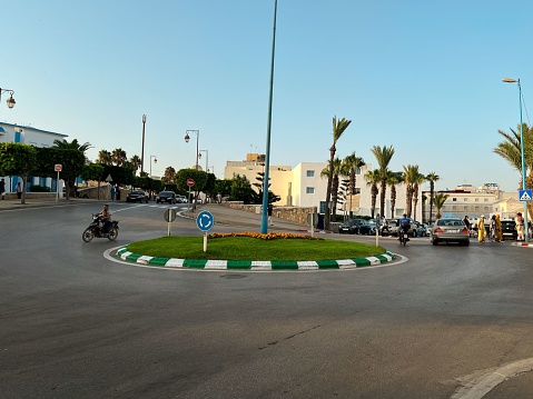 Fnideq, Morocco – July 25, 2022: Cars driving on the road in Fnideq