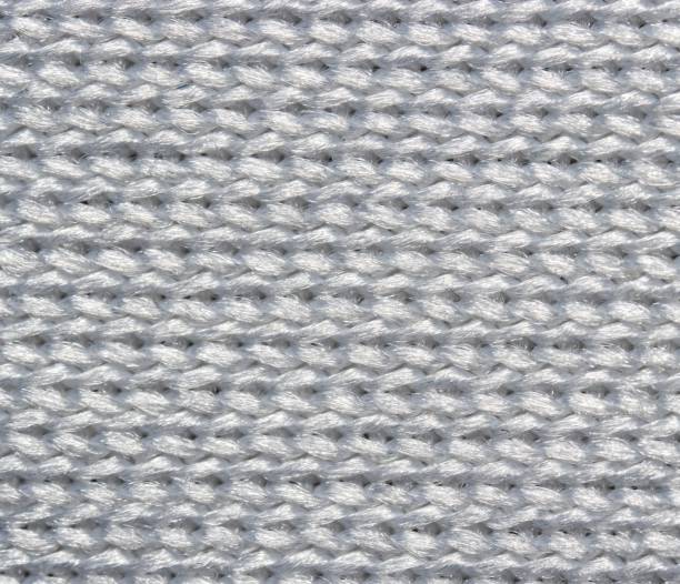 istock Ultra macro texture of white synthetic cloth 1437242053