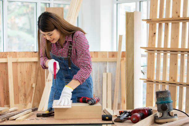 istock Asian handywoman apprentice working in a workshop 1437242805