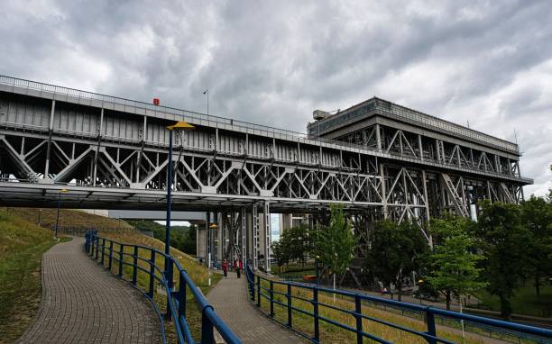 istock Old metallic ship lift under a cloudy sky 1437243164
