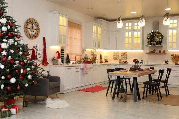 istock Cozy dining room interior with Christmas tree and beautiful festive decor 1437244331