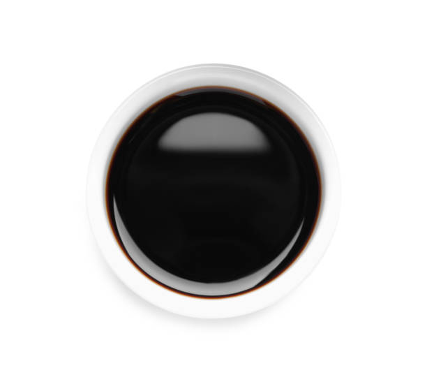 istock Soy sauce in bowl isolated on white, top view 1437245935